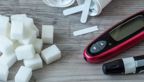 Sugar cubes on the table. Diabetes testing